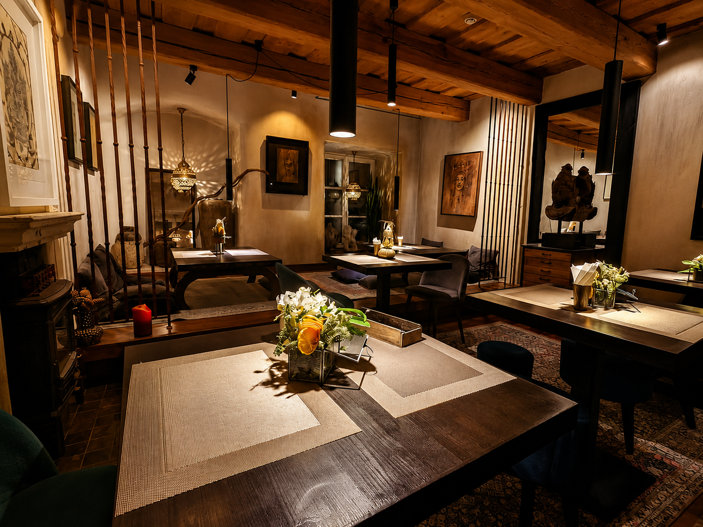 Warm, intimate AgniFood dining room with wooden beams and candlelight
